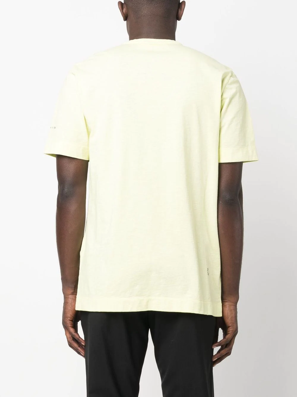 Yellow shirt worn by a person, showing the shirt's fit