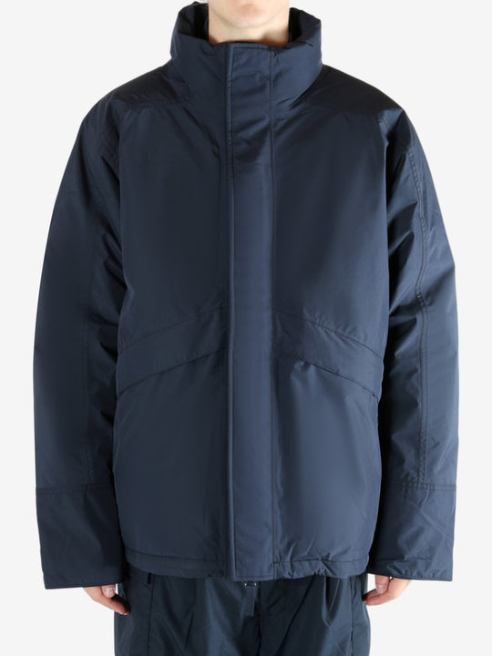 Navy jacket worn by a person, showing the jacket's fit