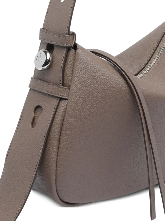 Close up of brown bag, showing the pin detail