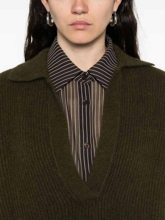 Close up of green shirt, showing texture of the fabric