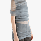 Grey shirt worn by a person, showing the tight fit.