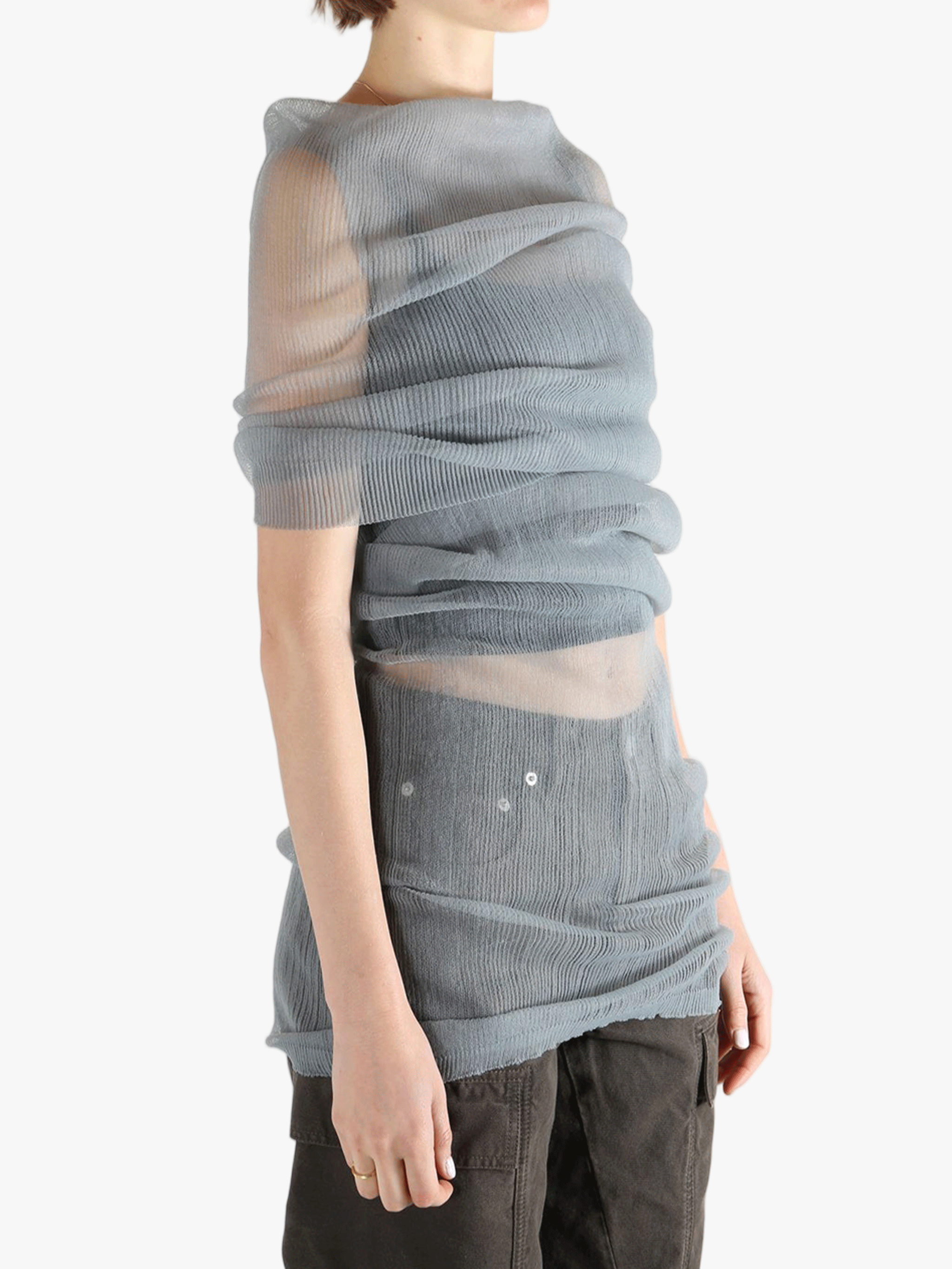 Grey shirt worn by a person, showing the tight fit.