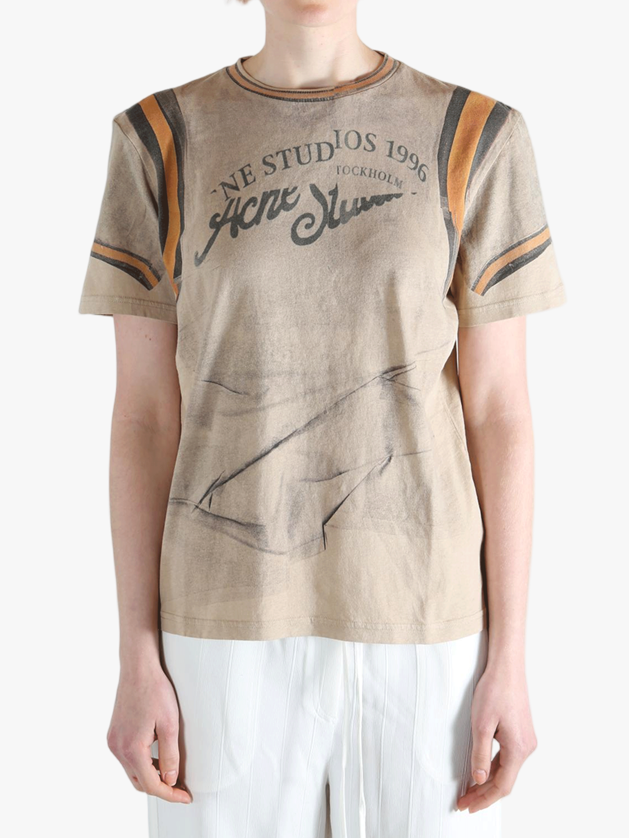 tan t-shirts worn by a person, showing the t-shirts fit