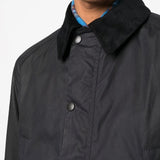 Close up of black jackets, showing texture of the polyester and cotton fabric