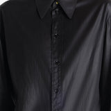 Close up of a black shirt, showing texture of the silk fabric