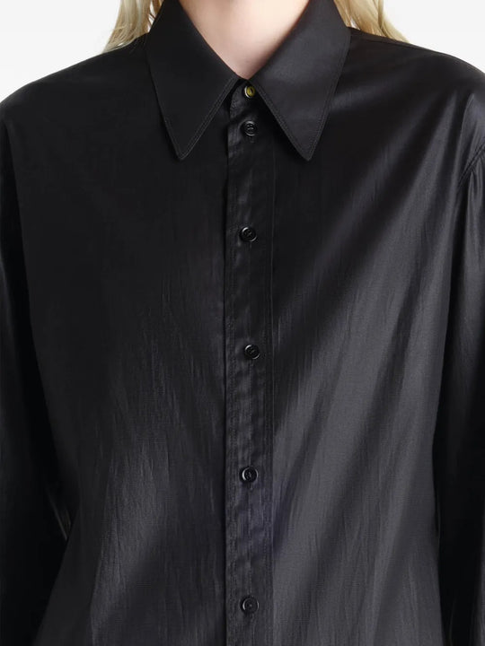 Close up of a black shirt, showing texture of the silk fabric