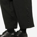 Close up of black pants, showing texture of the flax fabric