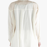 White shirt worn by a person, showing the shirt's fit