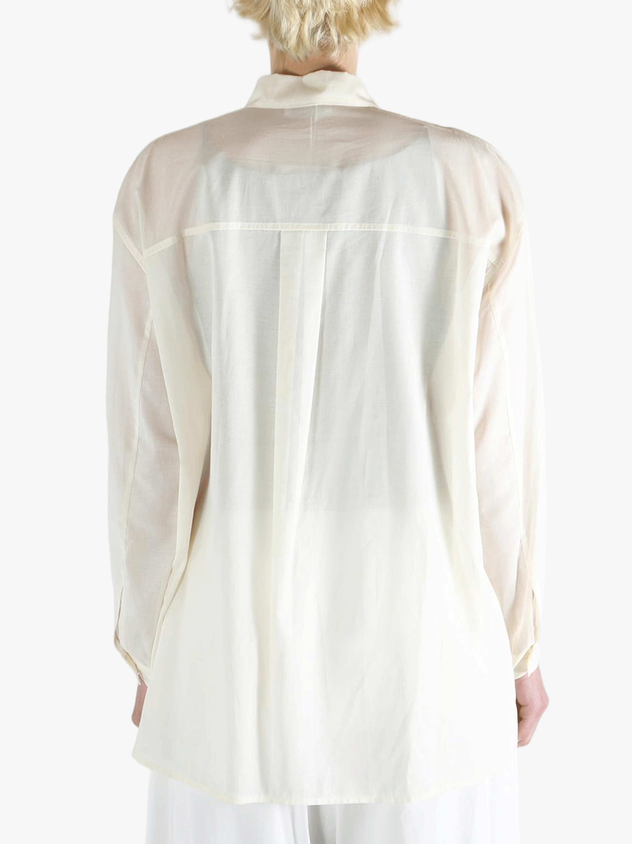 White shirt worn by a person, showing the shirt's fit