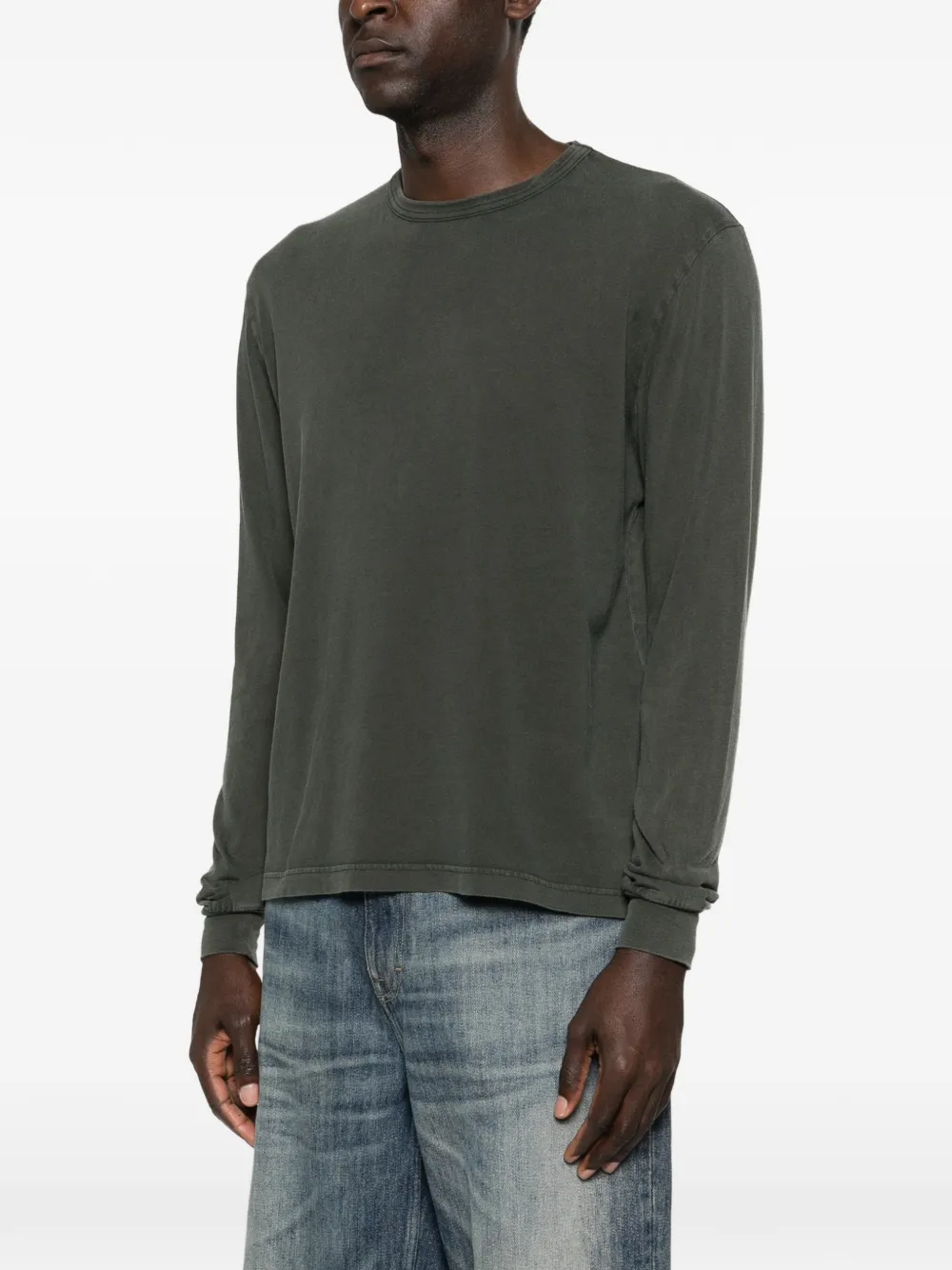 Grey knitwear worn by a person, showing the knitwear's fit