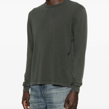 Grey knitwear worn by a person, showing the knitwear's fit