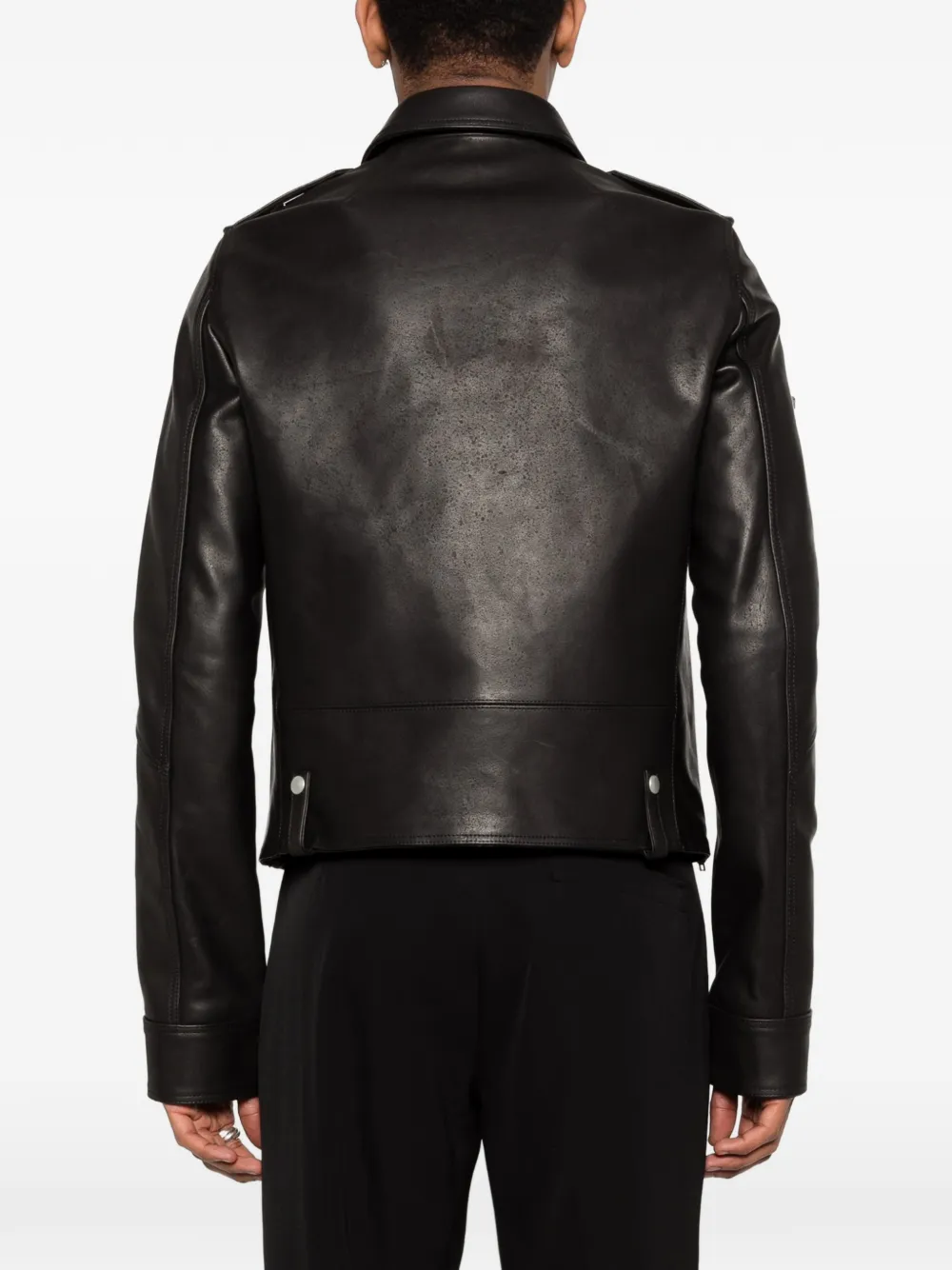 Black jacket worn by a person, showing the jacket fit