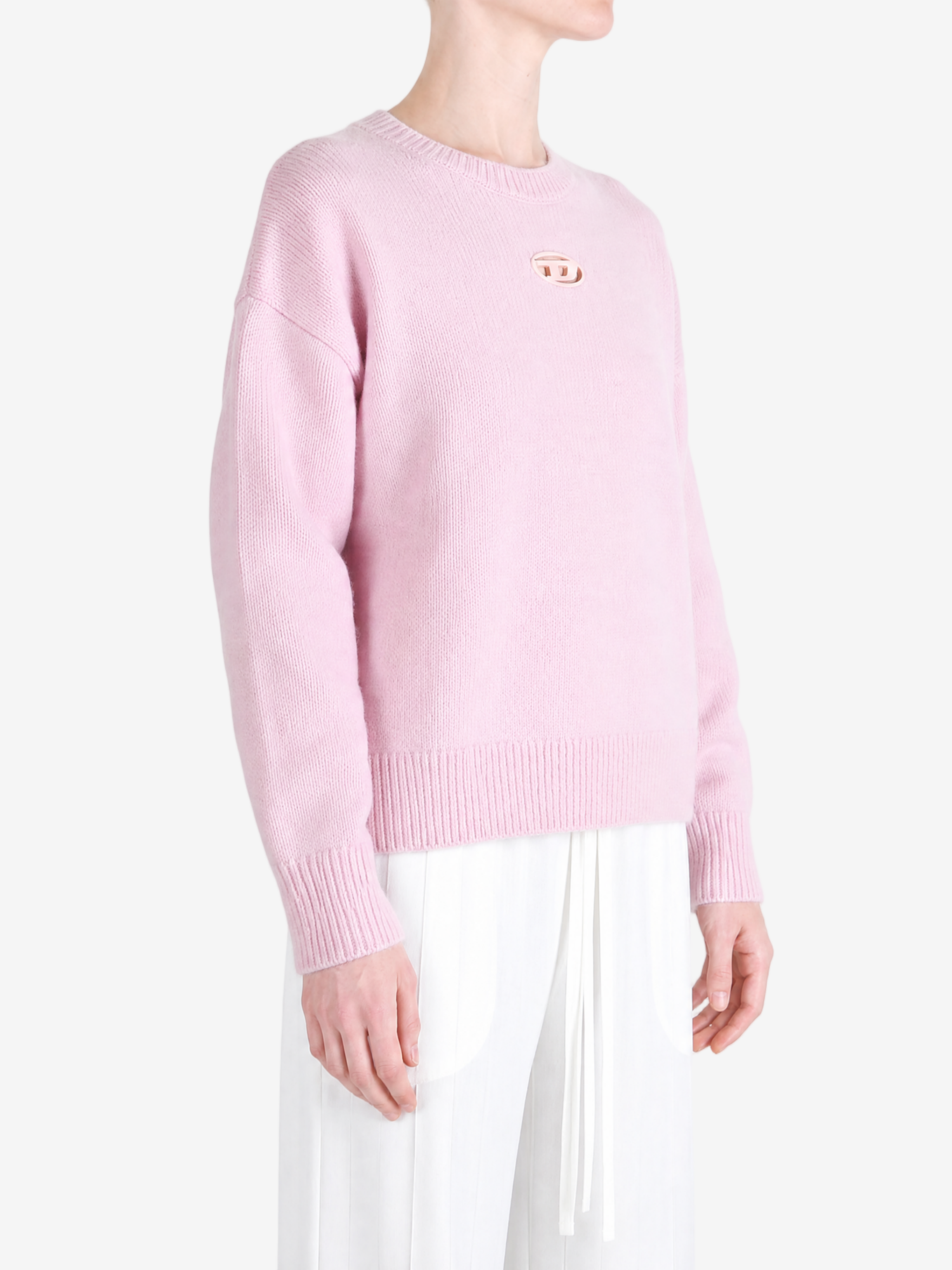 Pink hoodie worn by a person, showing the hoodie fit