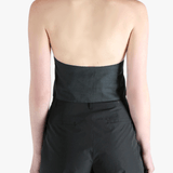 Black top worn by a person, showing the top's fit