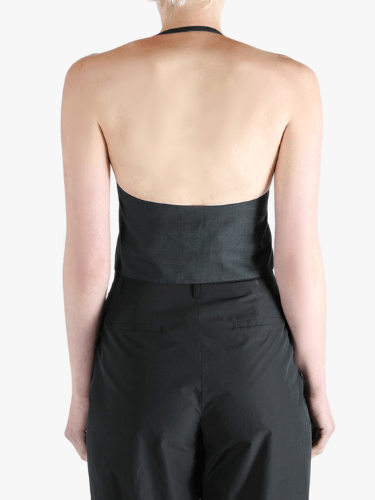 Black top worn by a person, showing the top's fit