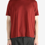 Red t-shirt worn by a person, showing the shirt's fit