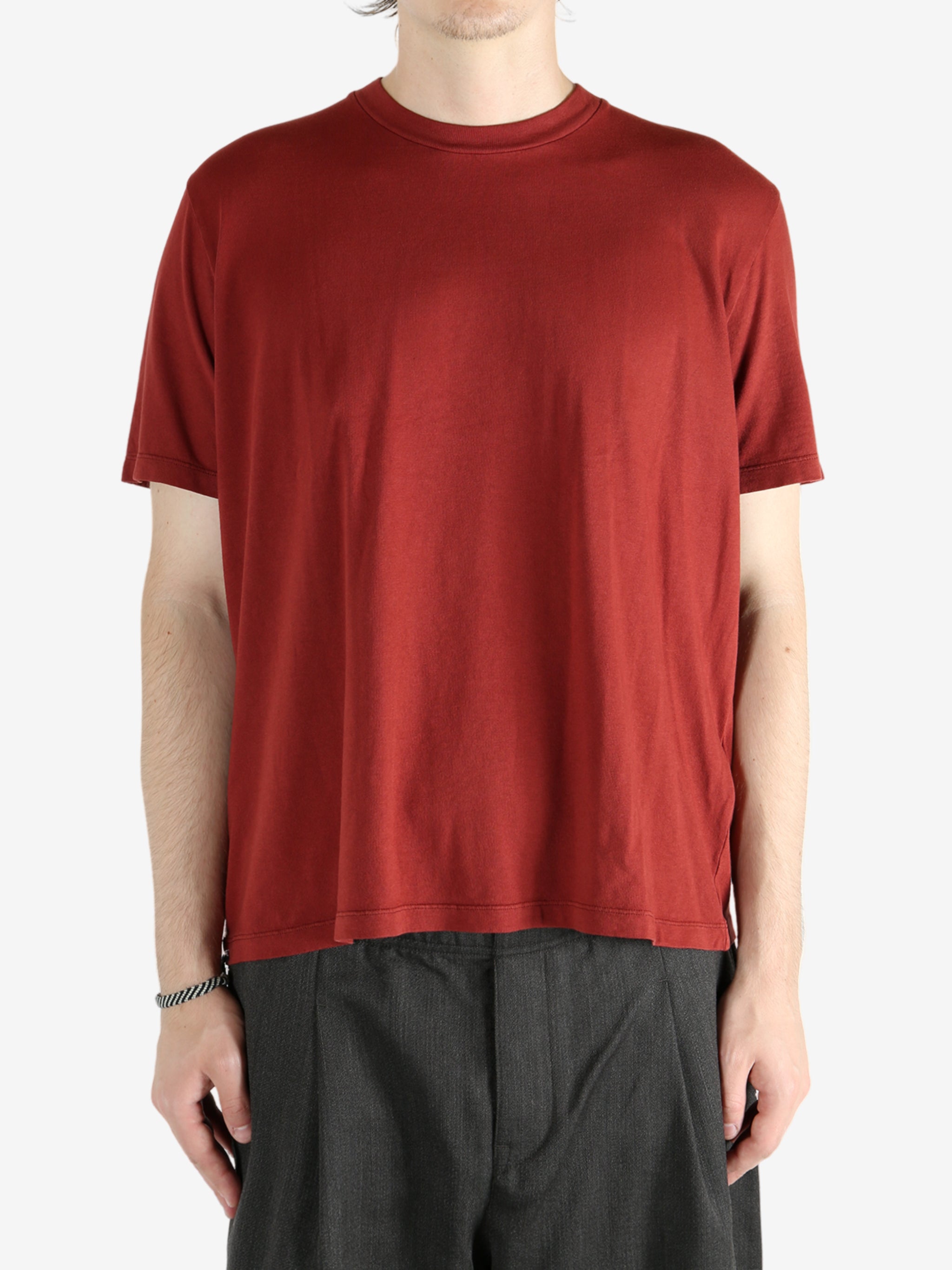 Red t-shirt worn by a person, showing the shirt's fit