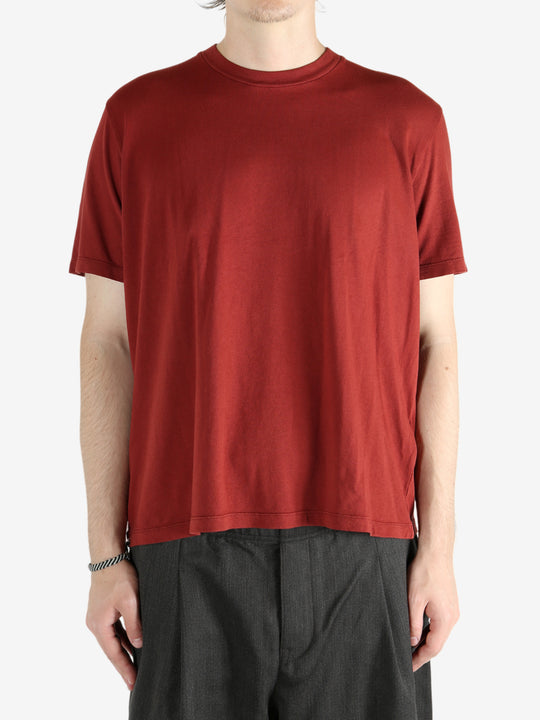 Red t-shirt worn by a person, showing the shirt's fit