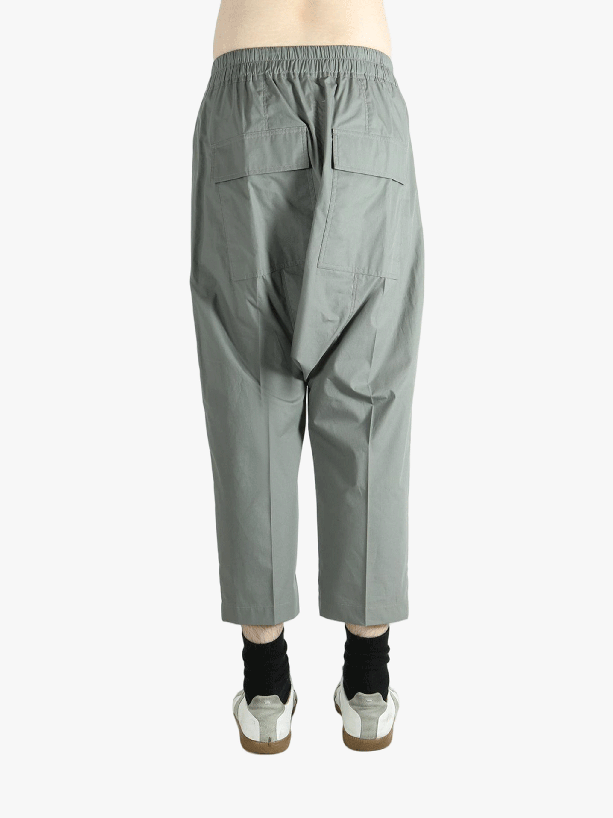 Grey pants worn by a person, showing the pants fit