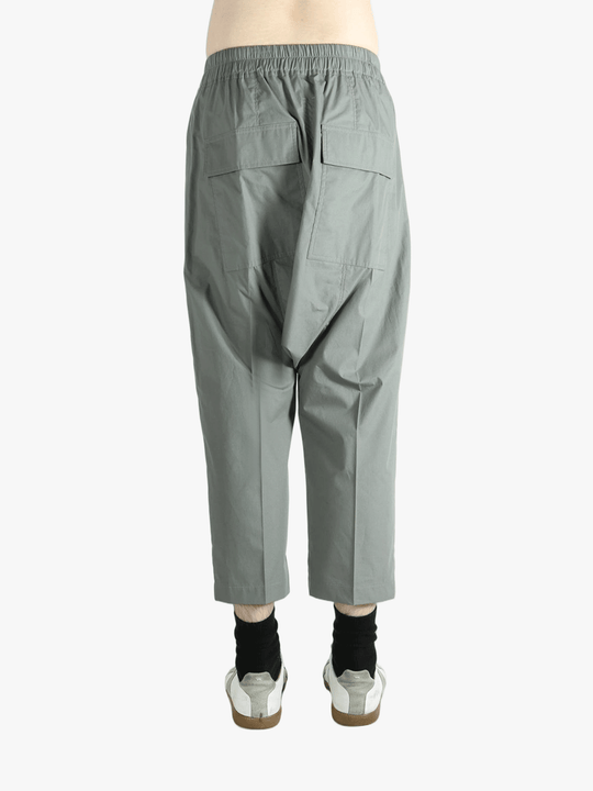 Grey pants worn by a person, showing the pants fit