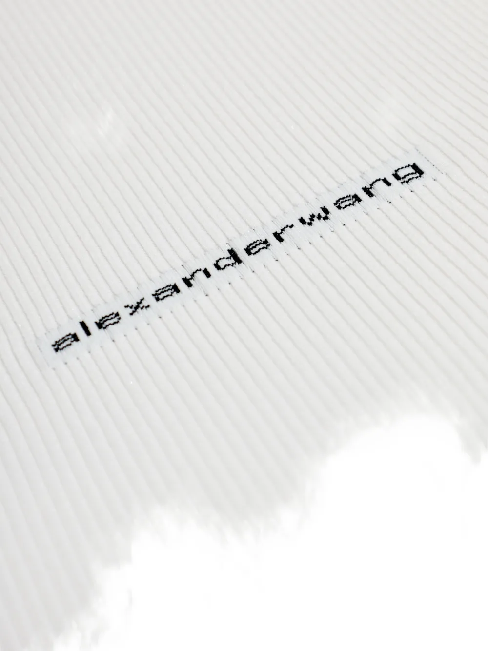 Close up of white t-shirts, showing texture of the cotton fabric