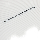 Close up of white t-shirts, showing texture of the cotton fabric
