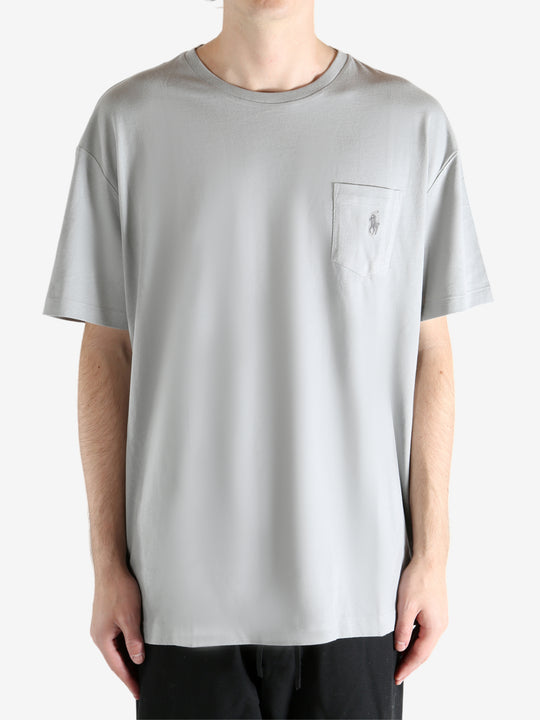 Grey t-shirts worn by a person, showing the t-shirts fit