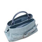 Close up of blue bags, showing texture of the suede cow leather fabric