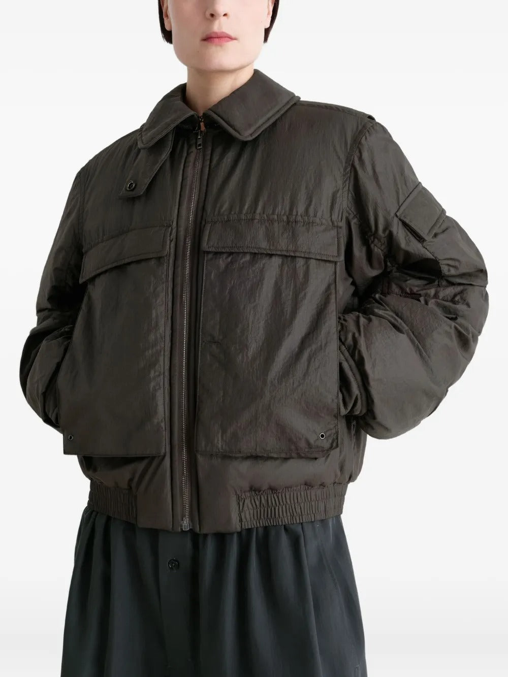 Brown coat worn by a person, showing the coat's fit