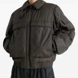 Brown coat worn by a person, showing the coat's fit