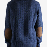 Navy sweater worn by a person, showing the sweater's fit