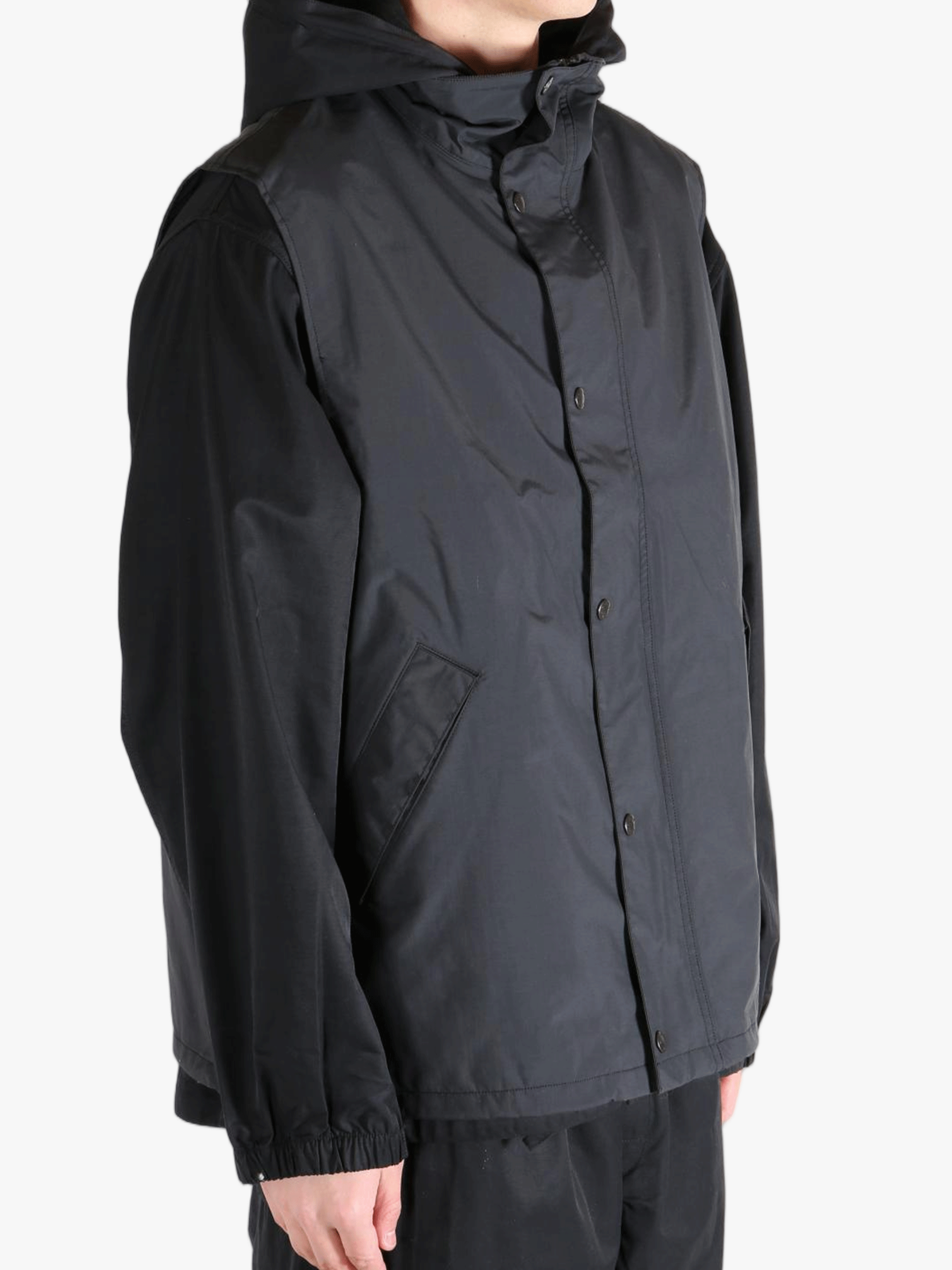 Black top worn by a person, showing the top's fit