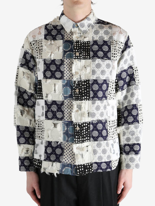 Blue shirt worn by a person, showing the shirt's fit