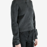 Grey cardigan worn by a person, showing the cardigan fit