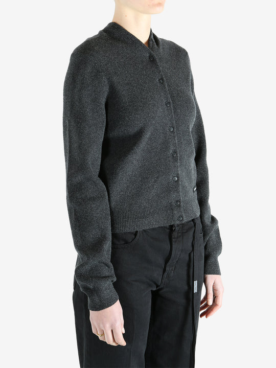 Grey cardigan worn by a person, showing the cardigan fit