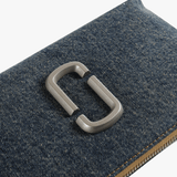 Close up of navy bags, showing texture of the fabric