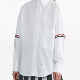 White shirt worn by a person, showing the shirt’s fit