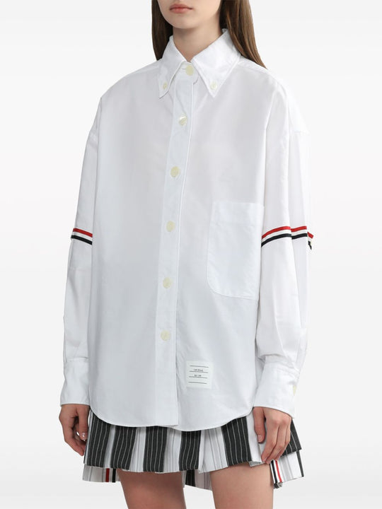 White shirt worn by a person, showing the shirt’s fit