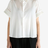 White shirts worn by a person, showing the shirts fit