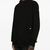 Black shirt worn by a person, showing the shirt's fit