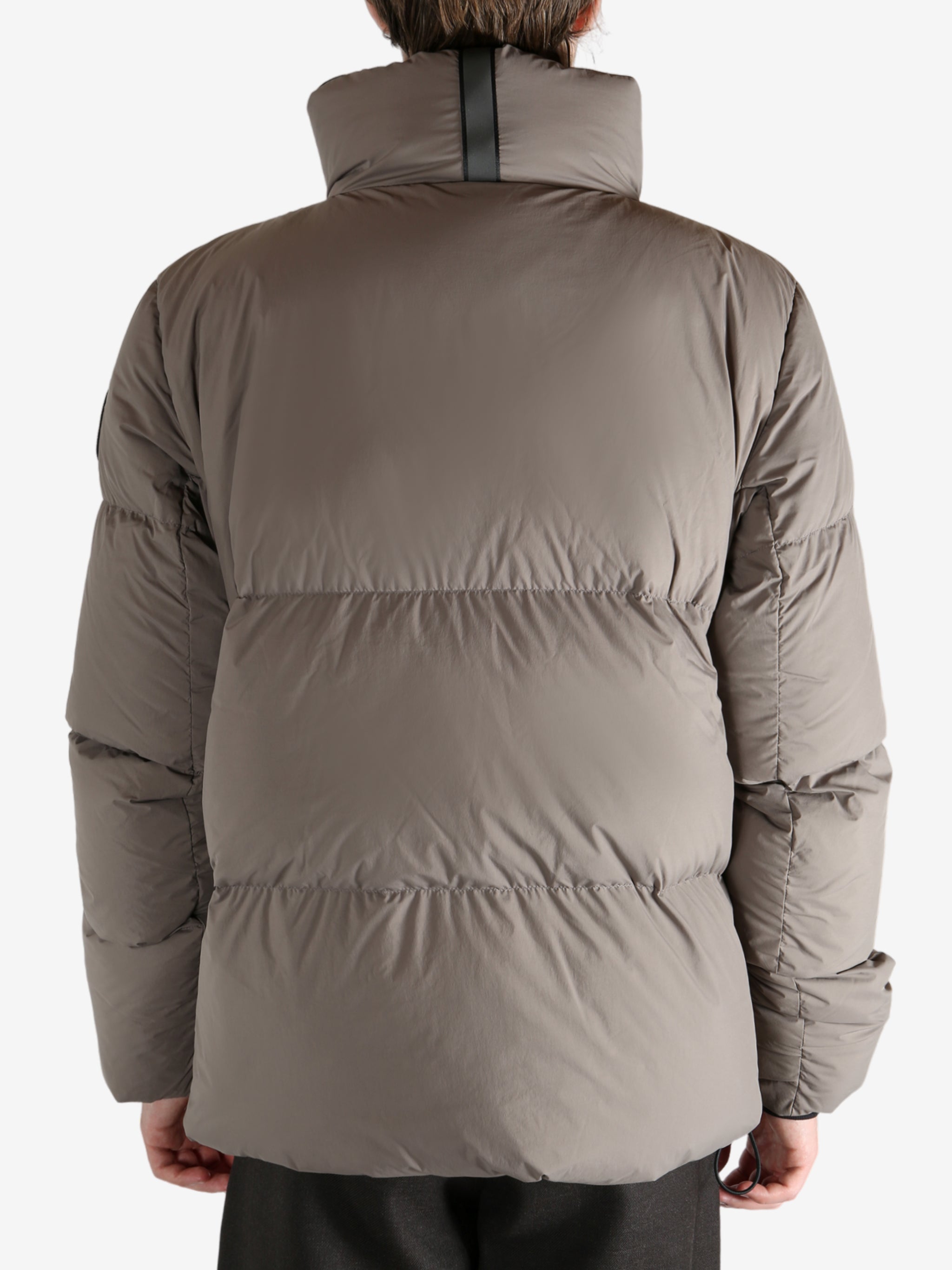 Grey jacket worn by a person, showing the jacket's fit