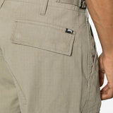 Close up of green pants, showing texture of the cotton fabric