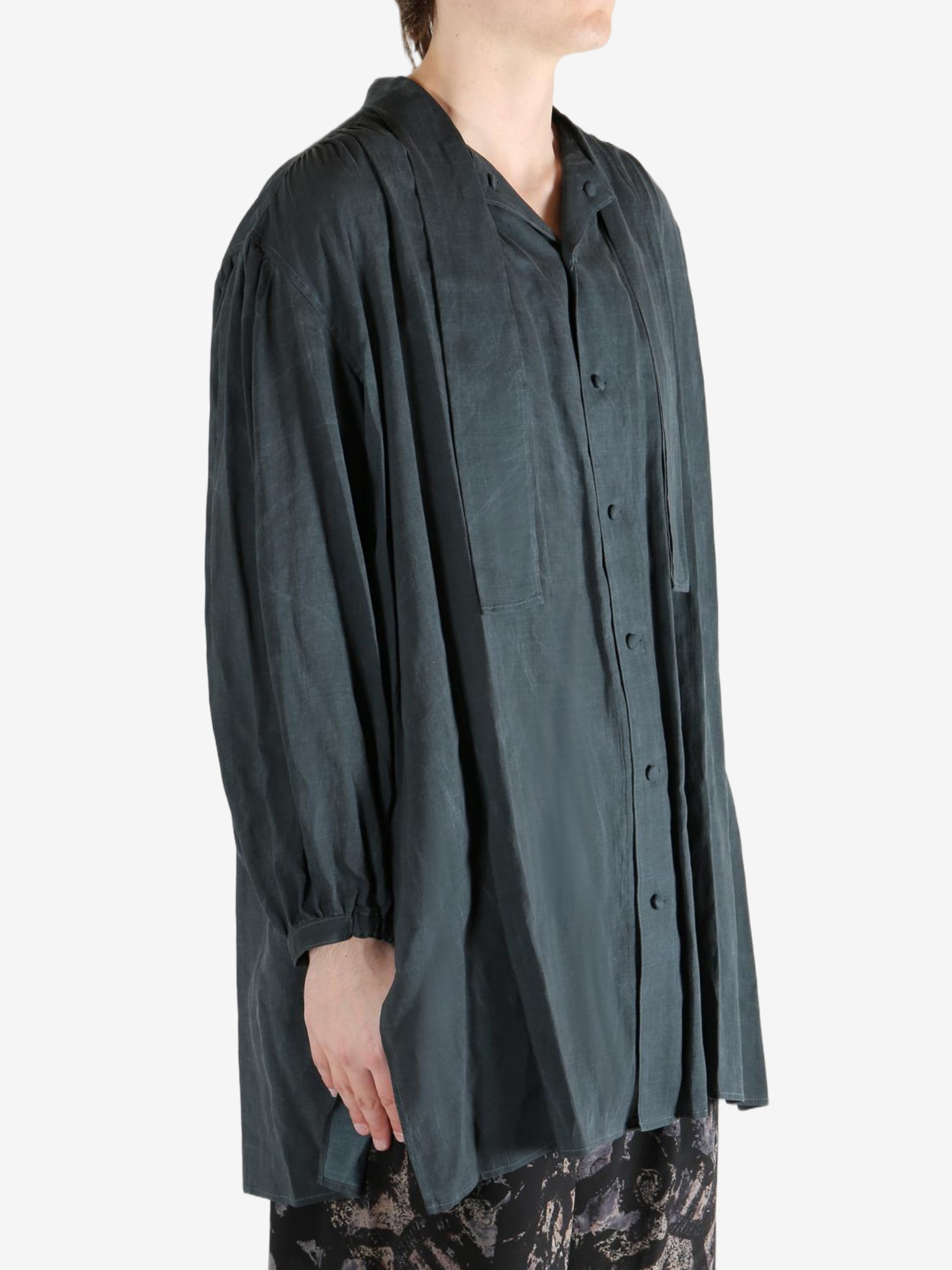 Black shirt,worn by a person, showing the shirt's fit