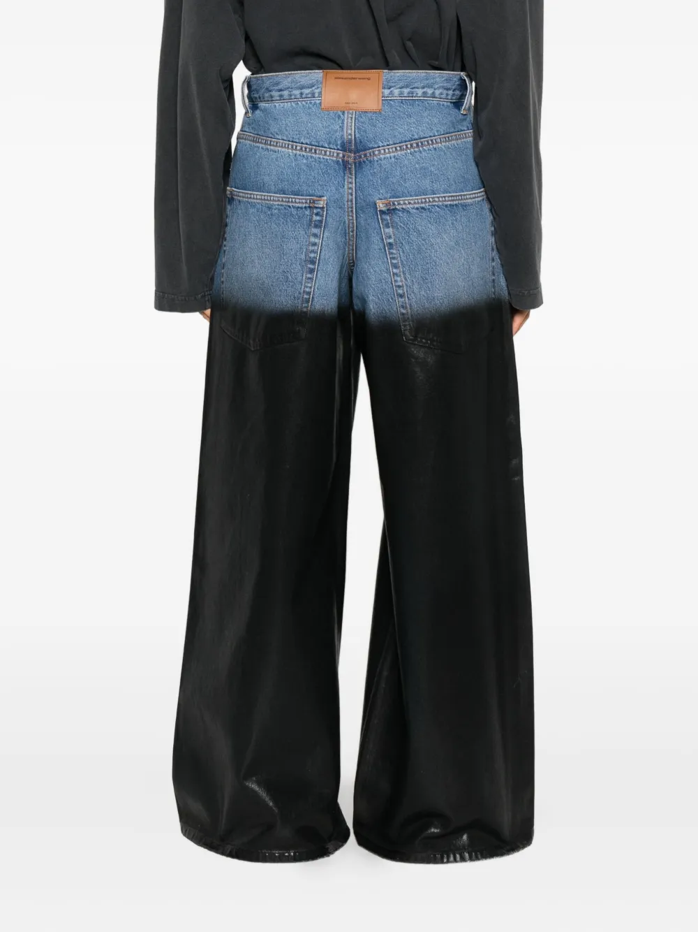 blue jeans worn by a person, showing the jeans fit