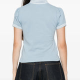 Blue top, full body view