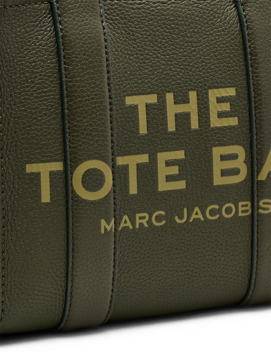 Close up of green bags, showing brand logo