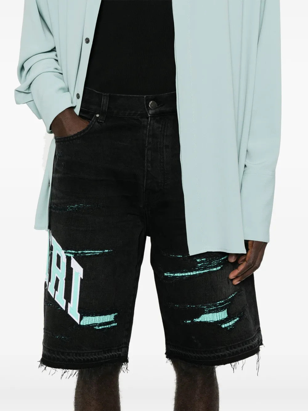 Black shorts worn by a person, showing the shorts fit