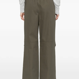 green pants worn by a person, showing the pants fit