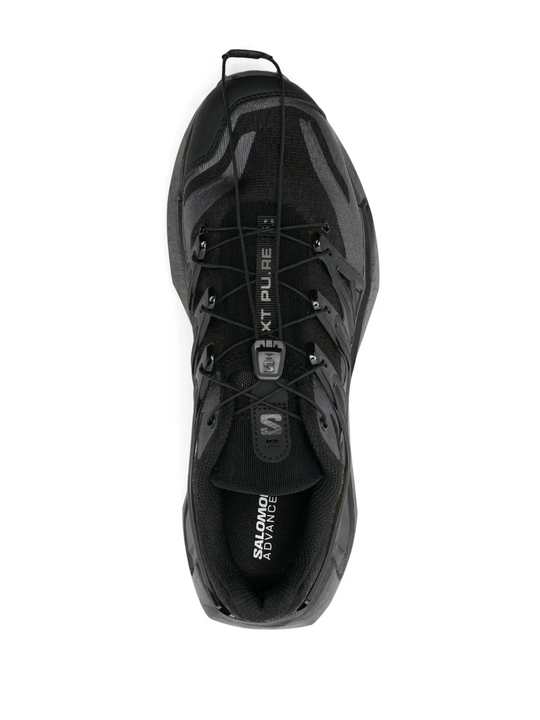 Black sneakers, vertical view