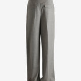 Grey pants worn by a person, showing the pants fit